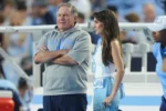 Bill Belichick and Jordon Hudson - Jordon Hudson on the UNC sideline during a game